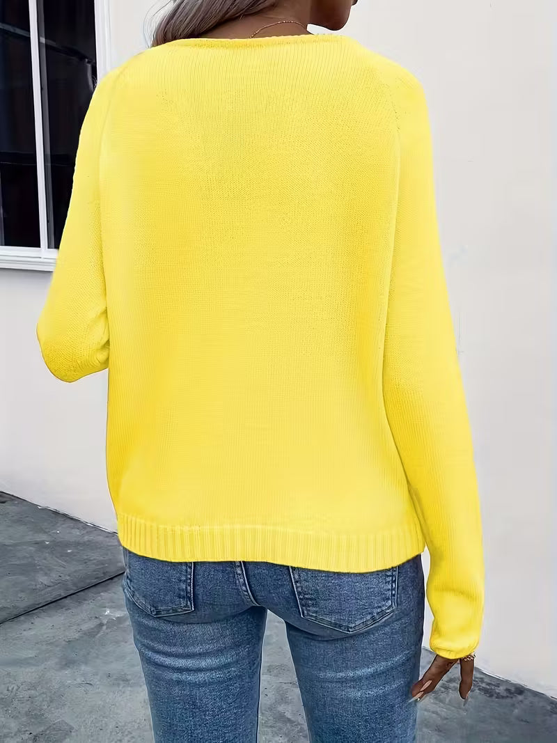 Maglione primaverile con dettaglio floreale